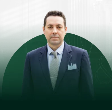 Portrait of David Volk, legal expert and attorney, standing outdoors in a professional setting.